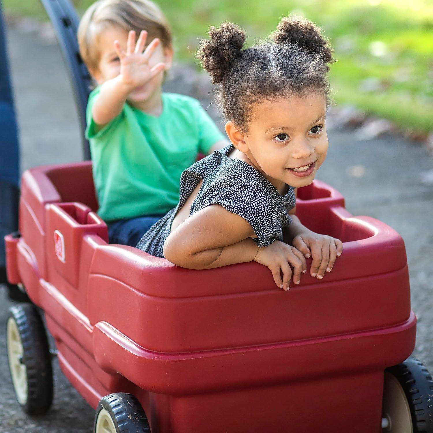 image:imageStep2 Neighborhood Wagon Kids Ride On Toy Stroller Substitute Includes Seat Belts Made of Durable Plastic Max Weight 75 lbs For Toddlers 155 Years Old RedRed